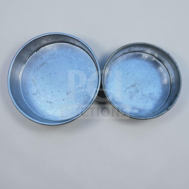 Set of 16 Commercial Pizza Equipment aluminum pizza baking pans in top-tier condition. Heavy-duty, ideal for restaurant use.