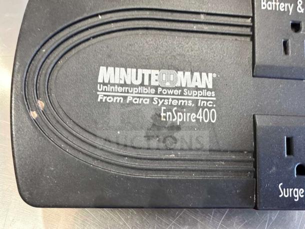 Minuteman EnSpire 400 UPS Battery Backup, 6 outlets, black, visible label showing model and brand, minor surface wear.