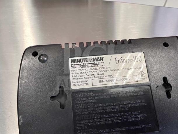 Minuteman EnSpire 400 UPS Battery Backup, 6 outlets, 400VA, model EN400, serial AE66140300877, high-quality condition.