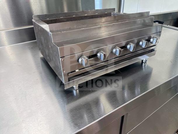 IDEAL 48" gas charbroiler grill with 6 burners, radiant char grill, excellent condition. Stainless steel, heavy-duty, fully tested.
