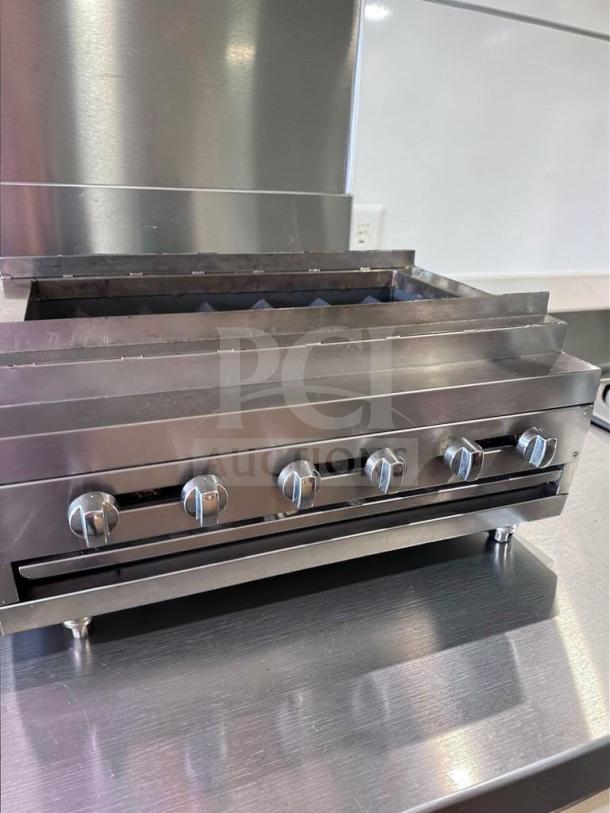 IDEAL 48" Gas Charbroiler, six burners, stainless steel, excellent condition, fully tested. Model IDE-L-CHAR-0694.