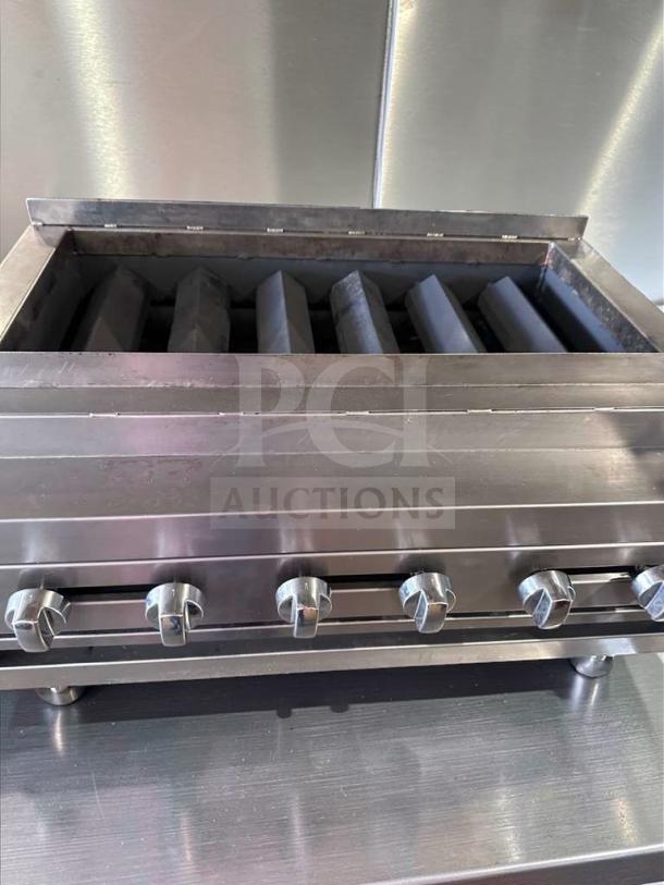 IDEAL 48" gas charbroiler grill, 6 burners, heavy-duty, excellent condition, tested, chrome knobs; model IDE-L-CHAR-0694.