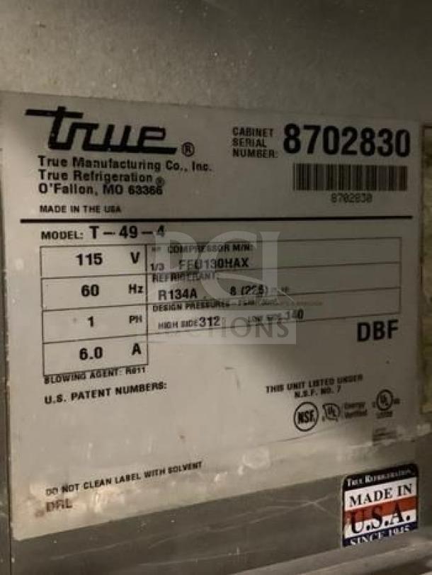 Label on True T-49-4 commercial refrigerator, showing model, voltage, refrigerant type, and "Made in USA" mark.