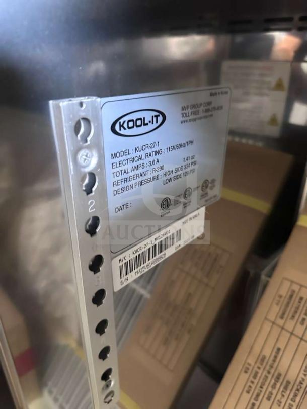 Brand new Kool-It KUCR-27-1 commercial undercounter freezer, 27.5", stainless steel, R290 refrigerant, ETL & NSF listed, model tag visible.