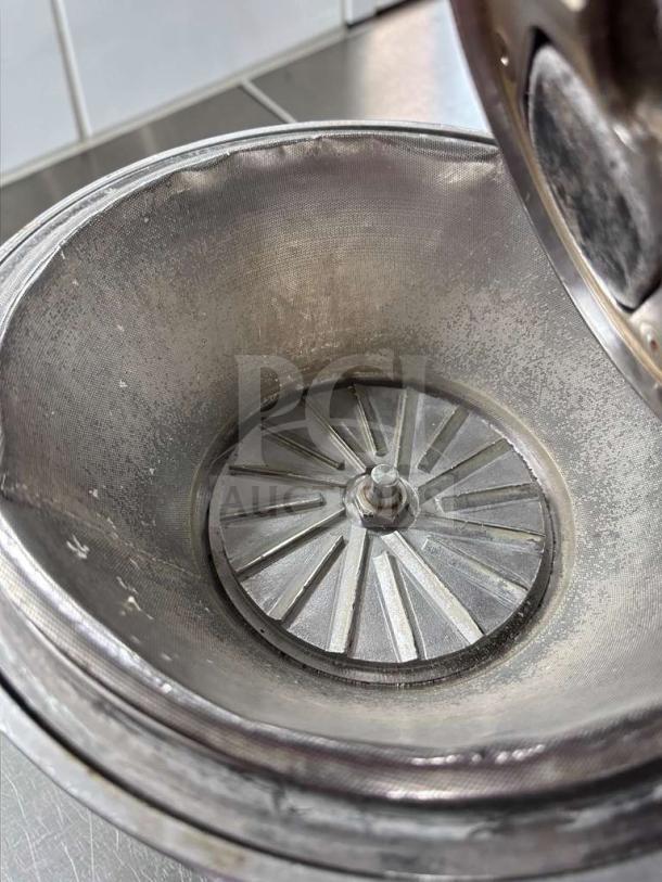 Nutrifaster N450 commercial juicer, heavy-duty stainless steel, interior view. Elite condition, fully operational.