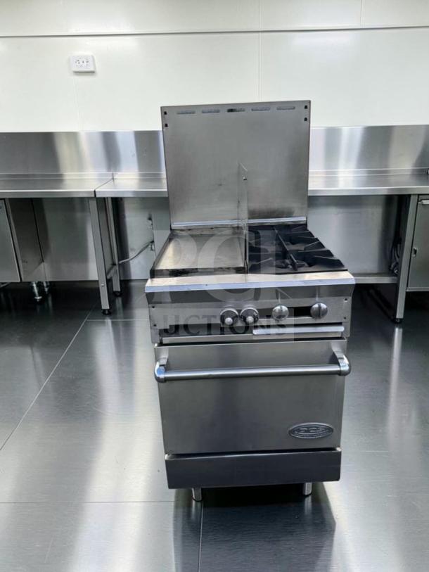 Southbend stainless steel commercial gas range with griddle, open burners, and oven base. Superior condition, fully tested.