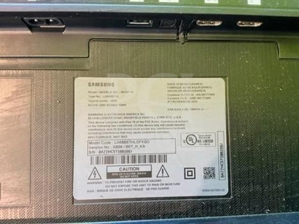 Label on Samsung Q6F Series 55” QLED 4K UHD Smart TV, model UN55Q6FAMFXZA, showing specifications and safety warnings.