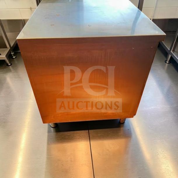 GSW stainless steel storage cabinet, 48"x30"x35", in exceptional condition. Heavy-duty, fully tested commercial worktop unit.