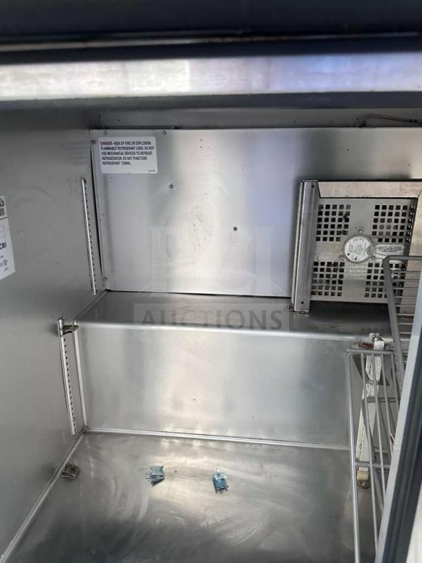 True TUC-48G-HC undercounter refrigerator, 48", stainless steel interior, 2 glass doors, fully operational, excellent condition.