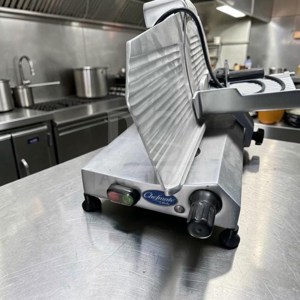 Globe C10 Chefmate meat slicer with 10" blade, stainless steel, belt-driven, 1/4 HP, tested and operational, Chefmate label visible.