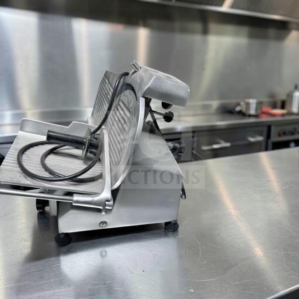 Globe C10 Chefmate meat slicer, 10" blade, stainless steel, belt-driven, 1/4 HP, excellent condition, fully tested, 115V.