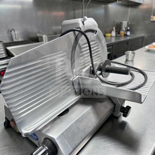 Globe C10 Chefmate manual meat slicer, 10" blade, stainless steel, belt-driven, in top-tier condition, fully operational.