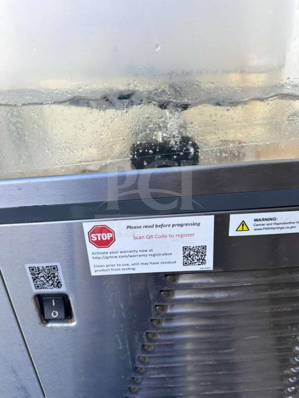 Crathco CS-4E-16-290 refrigerated drink dispenser with visible QR codes for registration, switch, and label instructions.