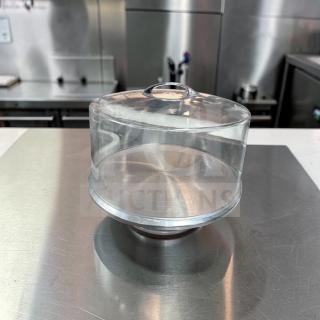 Clear acrylic cake display dome with a stainless steel base, 12" diameter, commercial grade, excellent condition.