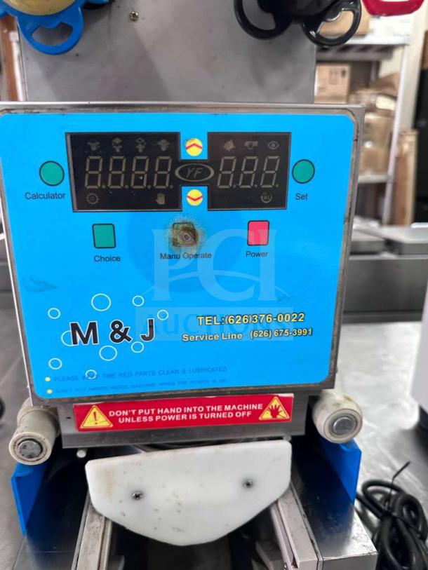 Y-Fang ET-999SN Tabletop Cup Sealing Machine, stainless steel, digital display, M&J logo, excellent condition.