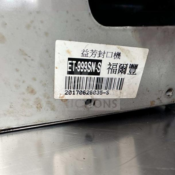 Y-Fang ET-999SN tabletop cup sealing machine, stainless steel, automatic, fully tested. Label shows model ET-999SN-S.