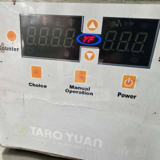 Touch panel of Y-Fang ET-99SU Cup Sealing Machine, featuring choice and manual operation buttons. Operational display.