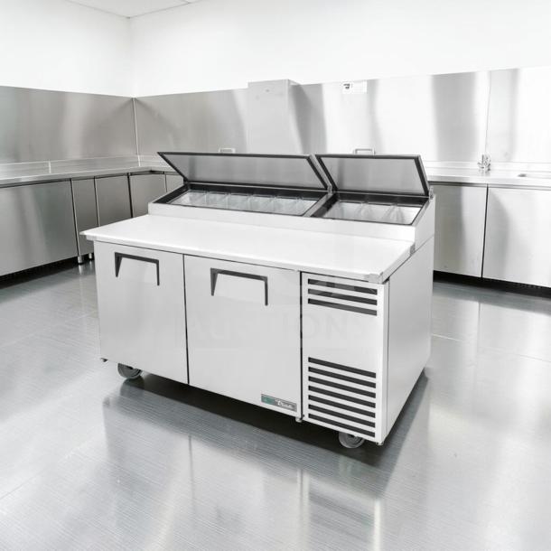Outstanding condition True TPP-AT-67-HC pizza prep table refrigerator with marble top, two doors, 115V, tested and operational.