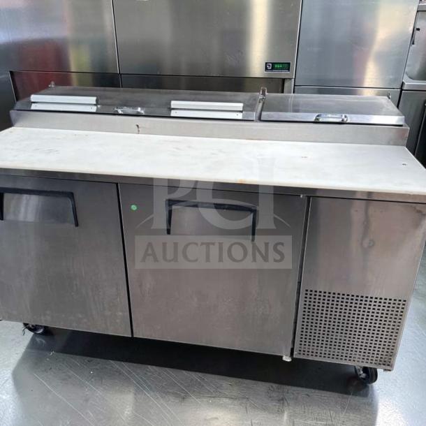 Outstanding condition True TPP-AT-67-HC pizza prep table refrigerator; 67", marble top, 2-door base, fully tested, 115V.