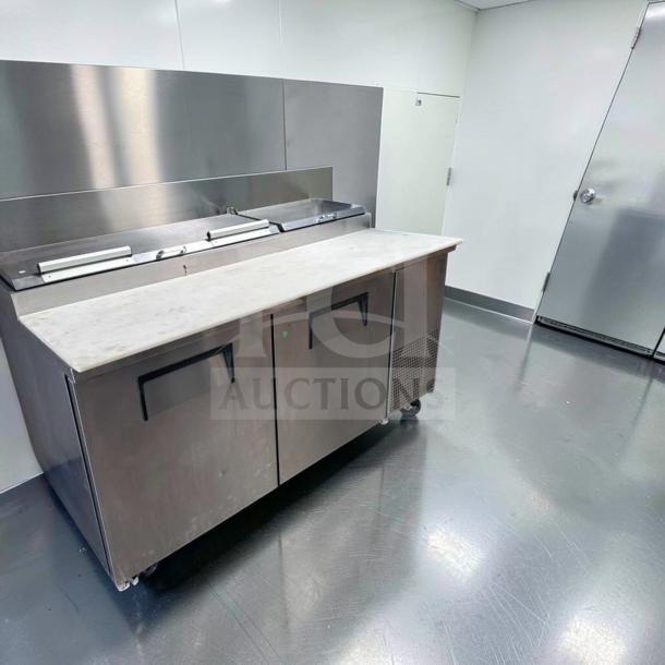 Outstanding True TPP-AT-67-HC pizza prep table refrigerator, marble top, 2-door base, excellent condition, fully tested.