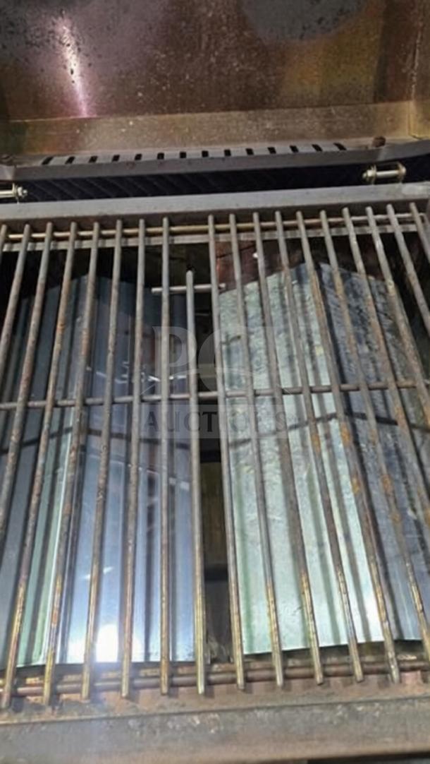 Nexgrill 820-0033 tabletop propane gas grill, stainless steel, dual burner, superior condition, interior view.