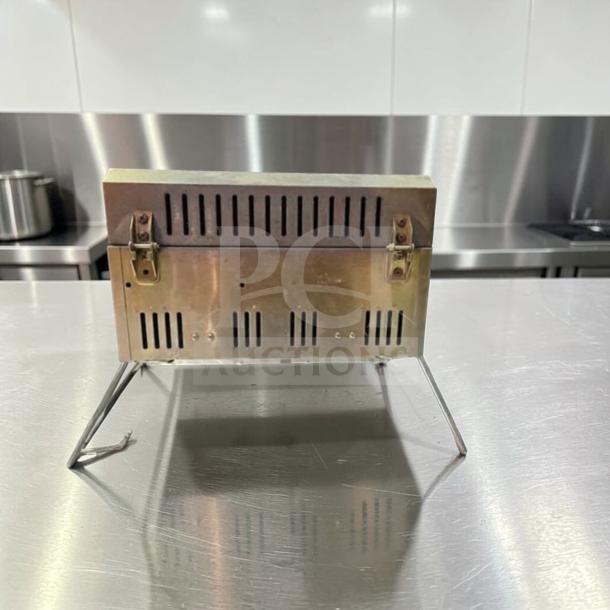 Nexgrill 2-burner portable propane grill, model 820-0033, stainless steel. Superior condition, fully tested, compact design.