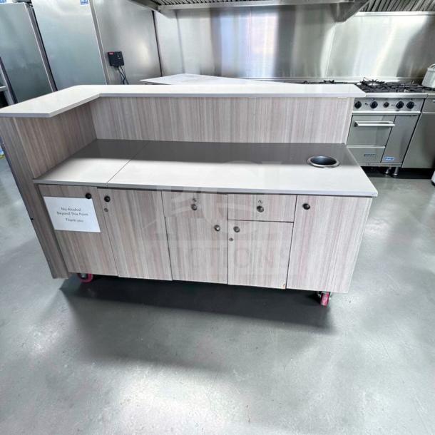 72" commercial service counter with laminate finish, storage cabinets, and trash cutout. Remarkable condition, custom-built.