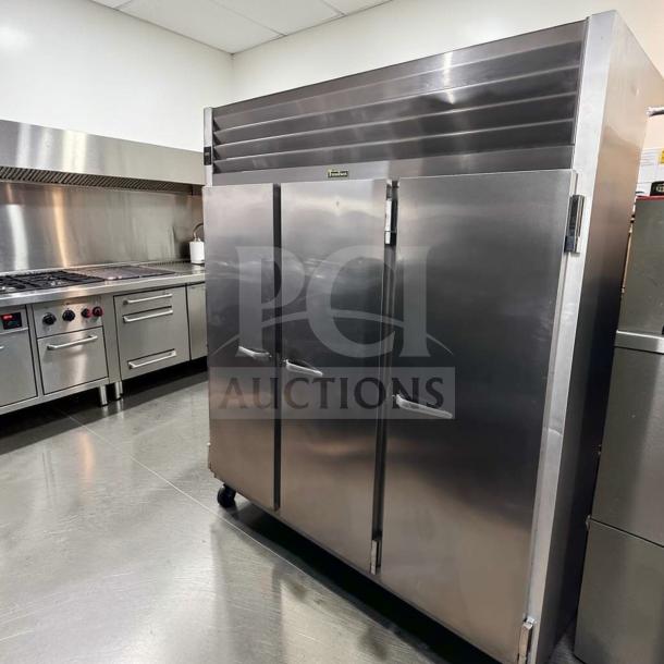 Traulsen G31310 three-section reach-in freezer, stainless steel, 77", solid doors, 208/115V, elite condition, fully tested.