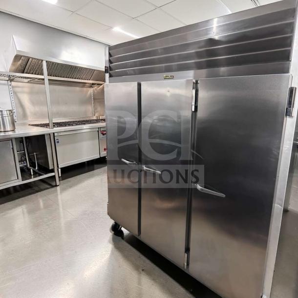 Traulsen G31310 reach-in freezer, 77" three-section solid door, stainless steel, excellent condition, fully operational.