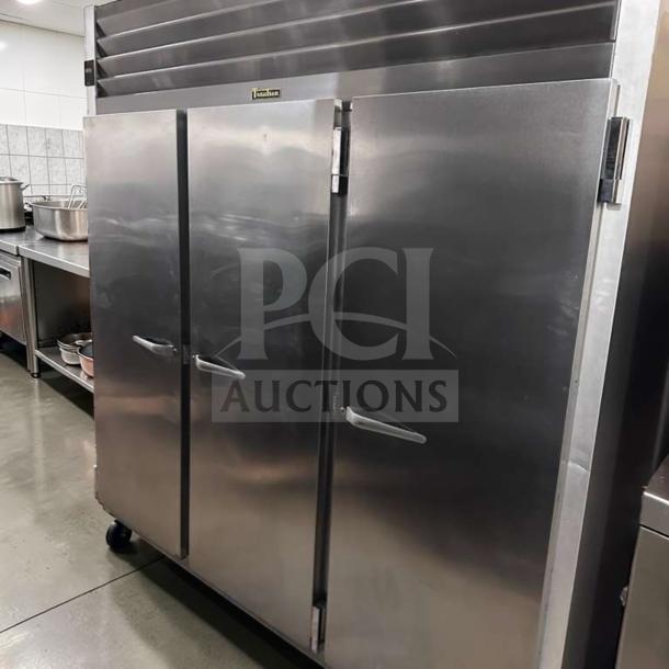 Traulsen G31310 reach-in freezer, 77" three-section solid door, stainless steel, elite condition, 208/115V, fully operational.