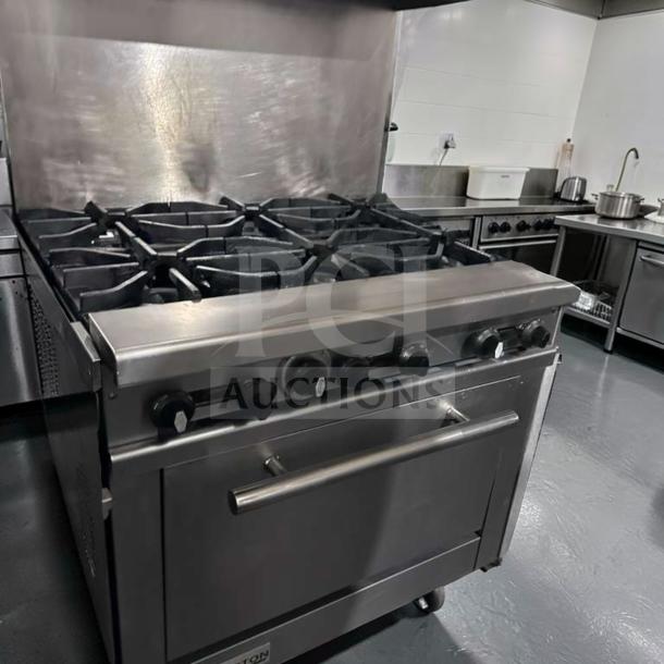 Connerton CN36-6_LP gas range, 36" wide, 6 burners, oven base, stainless steel, excellent condition, fully tested.