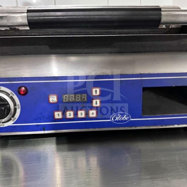 Superior condition Globe GSG14D Deluxe Panini Sandwich Grill with 14" x 14" smooth plates, digital display, and blue control panel.