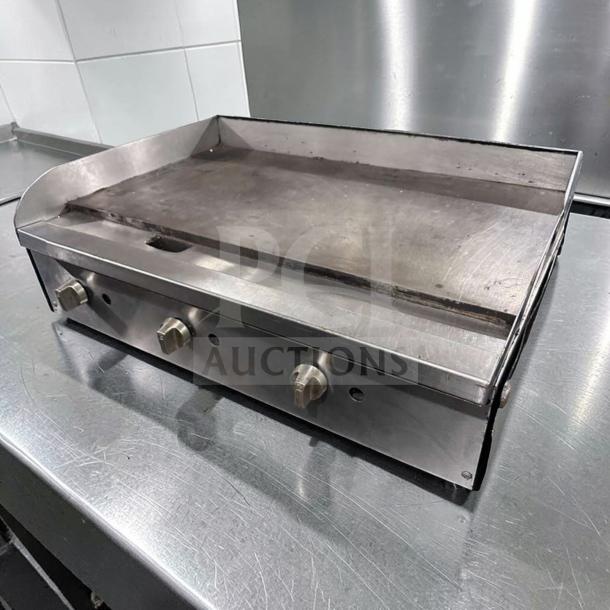 36" Commercial Gas Griddle in excellent condition, stainless steel, heavy-duty, fully operational, features three control knobs.