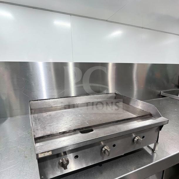 Commercial 36" gas griddle, stainless steel, heavy-duty flat top, excellent condition, fully operational, model GRD-M-GAS-0868.
