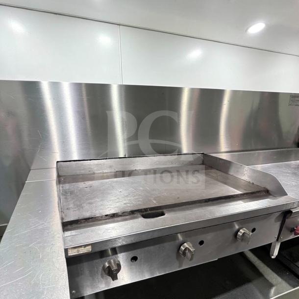 Commercial 36" gas griddle in excellent condition, stainless steel, heavy-duty flat top, fully operational, model GRD-M-GAS-0868.