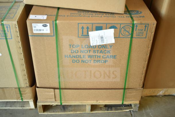 Cardboard box containing a Globe SG13-84 commercial slicer, marked "Top Load Only" and "Handle with Care."