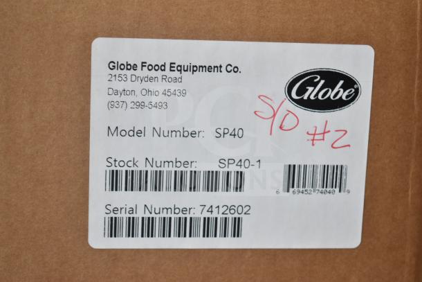 Globe Varimixer SP40 label showing model, stock, and serial numbers with company details and "S/D #2" marking.