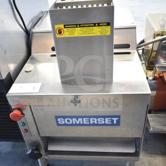 Somerset CDR-170 countertop dough moulder for 6-15" loaves. 110V, 1 phase, stainless steel, commercial use, safety warning visible.
