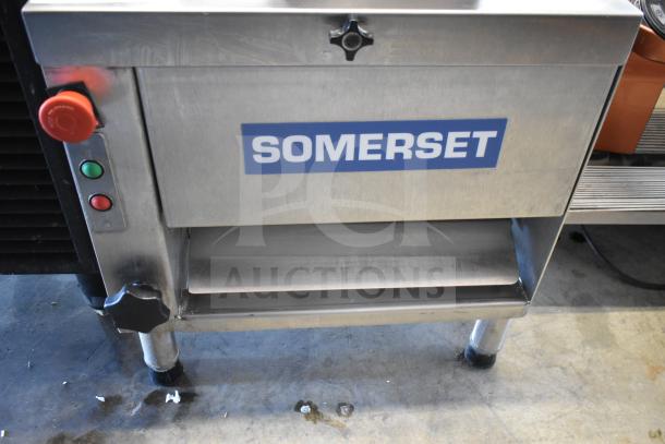 Somerset CDR-170 countertop dough moulder, 110V, for 6-15" loaves, stainless steel, visible brand label, red and green buttons.