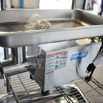 BRAND NEW Pro-Cut OKG12SS electric meat grinder, 115 volts, scratch and dent. Visible labels and power cord included.