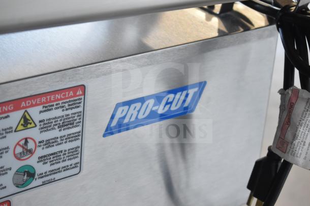 Pro-Cut OKG12SS Commercial Electric Meat Grinder, new, scratch, and dent, 115V. Features warning labels, model tag visible.