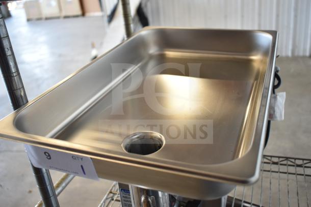 Pro-Cut OKG12SS commercial meat grinder, new condition, stainless steel tray, visible control label, 115 volts, ready for use.
