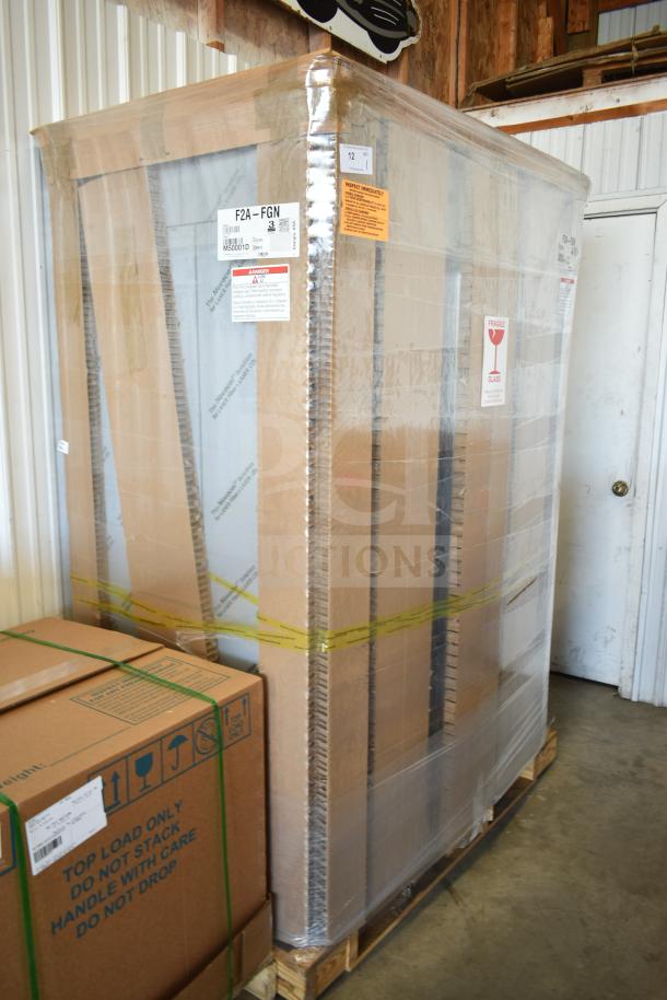 Brand new 2022 Hoshizaki F2A-FGN freezer, two-section upright, full glass doors, model and safety labels visible, 115 volts.