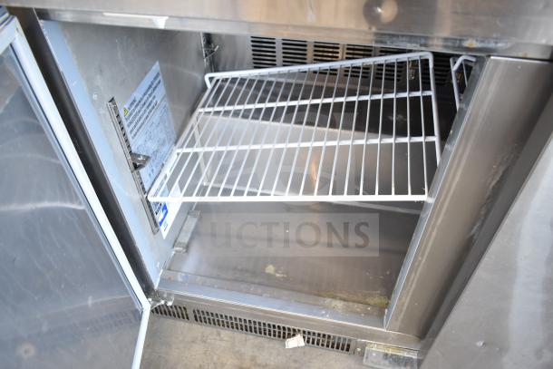 2023 Avantco 178ZWT48FHC Worktop Freezer, 48", stainless steel, interior view, adjustable shelf, label with voltage info.