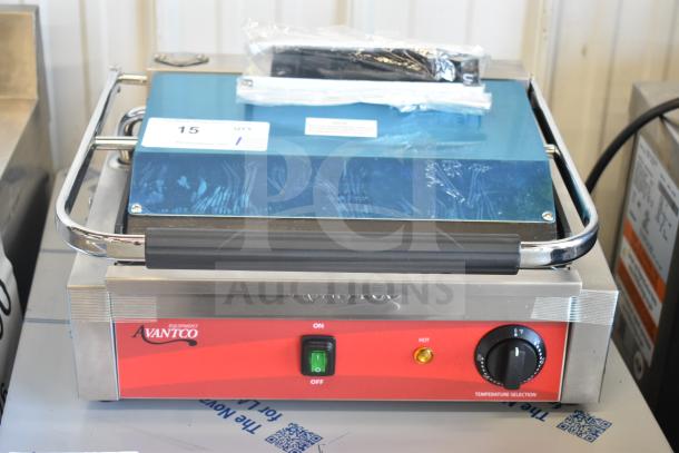Brand new Avantco 177PG200 Panini Grill, grooved plates, 13 3/8"x8 3/4" surface, 120V, with protective wrap.