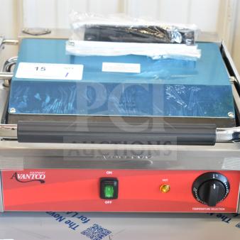 Brand new Avantco 177PG200 Panini Grill, grooved plates, 13 3/8"x8 3/4" surface, 120V, with protective wrap.