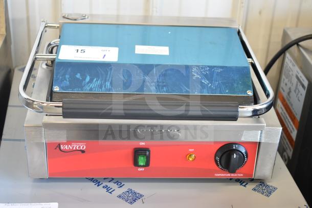 Brand new Avantco 177PG200 commercial Panini grill with grooved plates, 13 3/8" x 8 3/4" surface, 120V, 1 phase.
