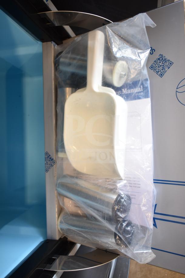 Brand new Avantco 194EUCF130A ice machine, included accessories in packaging, manual visible, 44 lb. bin capacity.