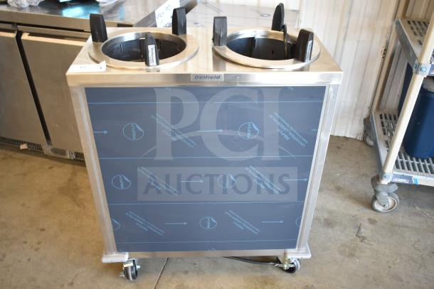 BRAND NEW Delfield CAB2-1013ET heated dish dispenser with dual columns, on commercial casters. Scratch and dent condition.