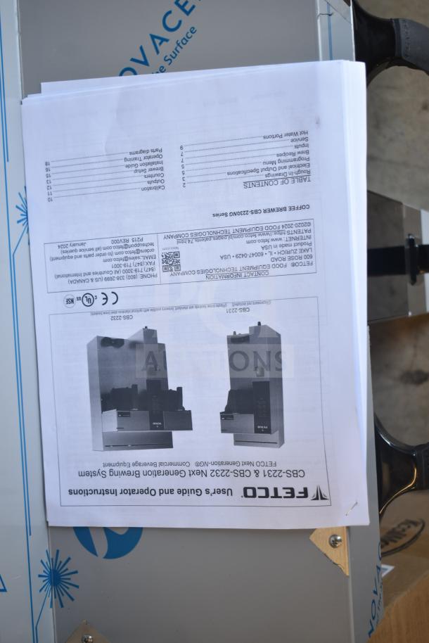 Brand new 2024 Fetco CBS-2232 thermal coffee maker shown with instruction manual, minor scratches visible, 208-240V, 1 Phase.